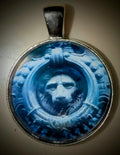 Macro photography pendant of the historic Lion of Firenze (Marzocco), capturing the weathered texture of Florentine stone in a decorative stainless steel round frame.